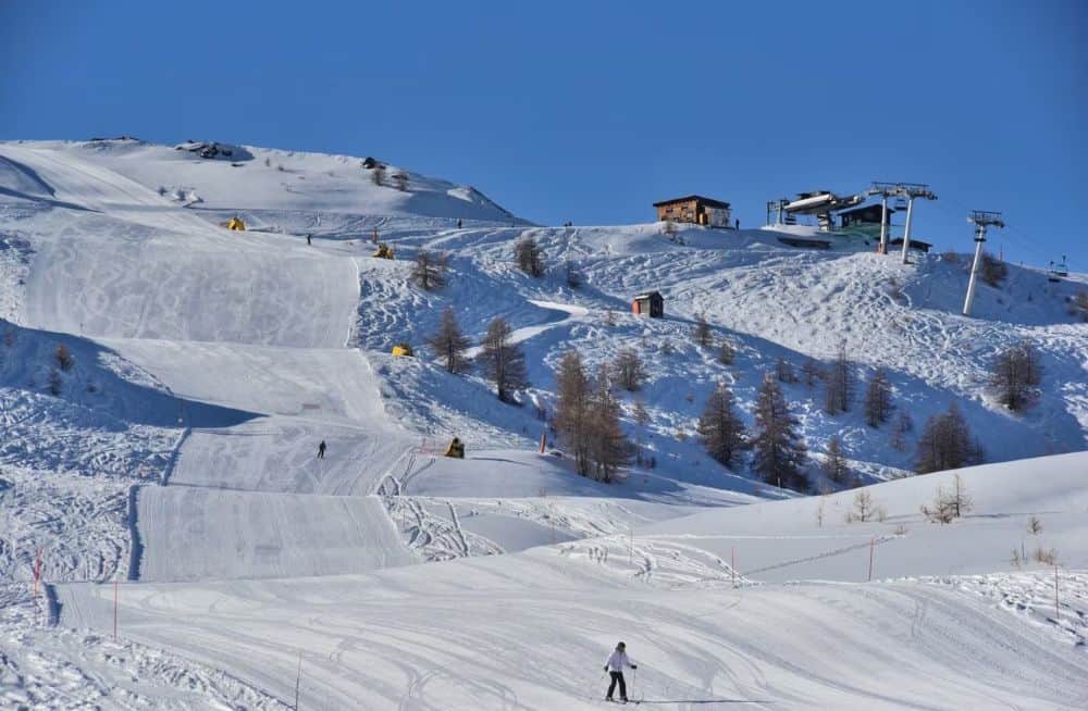 Snow-covered ski slope and mountain landscape at Miriam Memoirs.