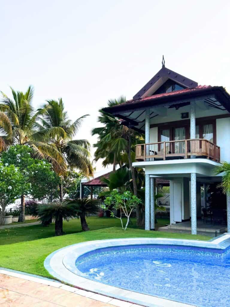 Miriam Vasconcelos in Ramada Resort standing in near the villas in Kerala